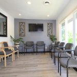 {PRACTICE_NAME} waiting room with chairs lining the walls